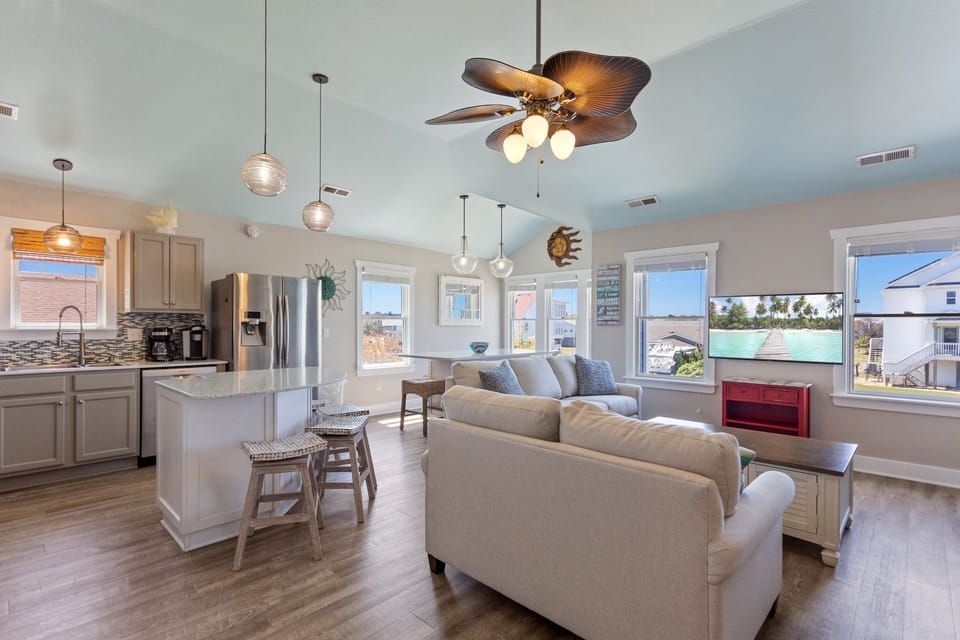 The spacious Mid-Level Living Area is ideal for watching your favorite shows and plan another day of exciting Outer Banks adventures.