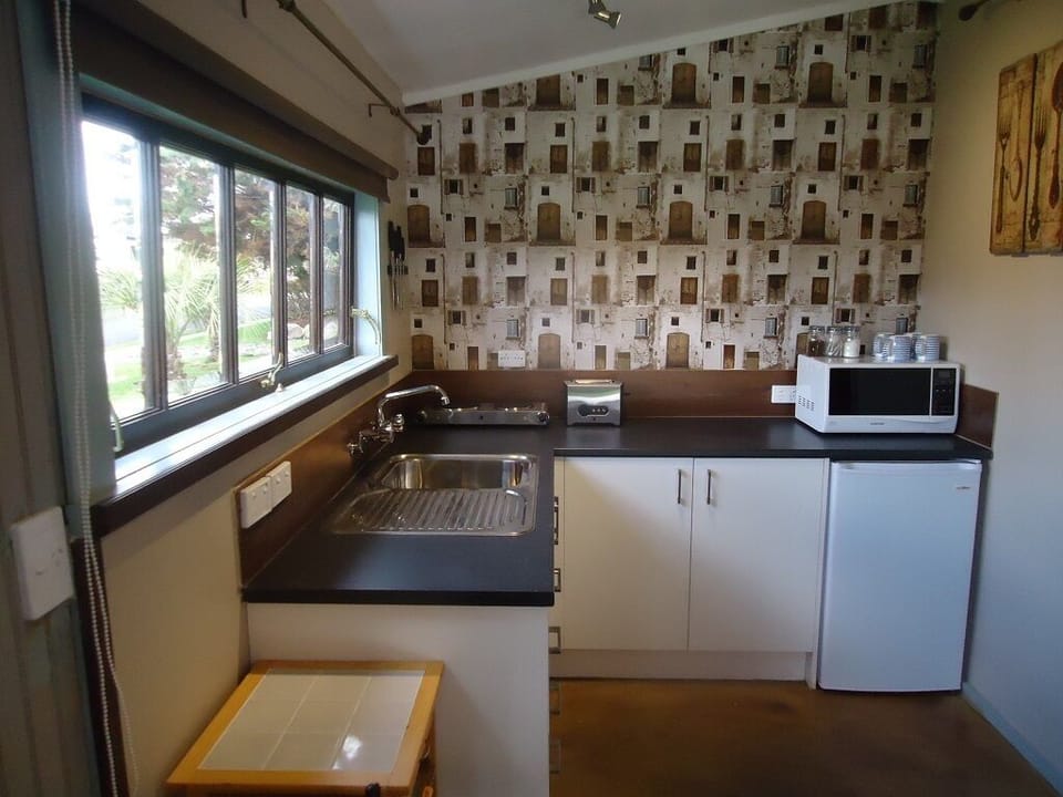 Kitchenette  with Microwave, Hotplate, Fridge & Kitchen utensils you would need.