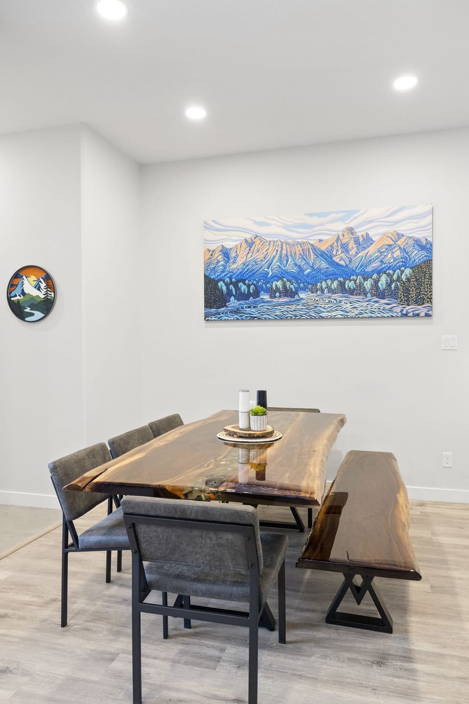 Custom live edge epoxy table with river rocks. Seating for 8.