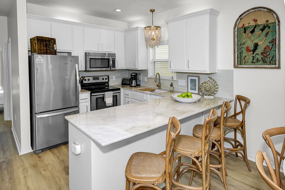 Upgraded kitchen with Taj Mahal counters.