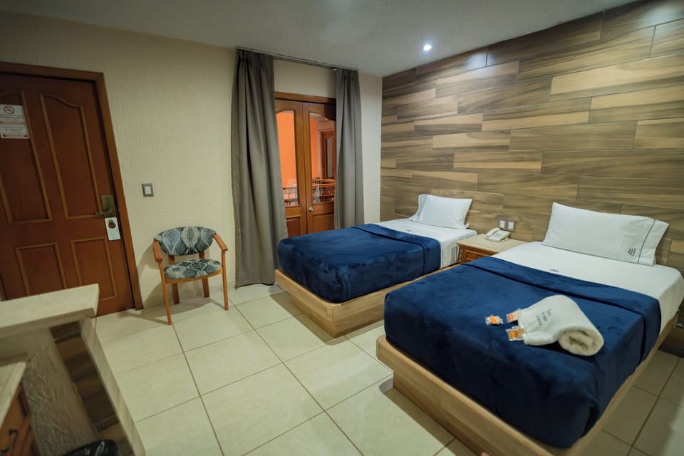 Standard Quadruple Room, 2 Double Beds | In-room safe, desk, iron/ironing board, free WiFi