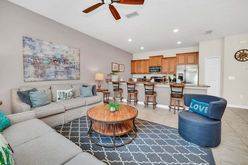 The space perfectly integrates the living room, dining room and kitchen.