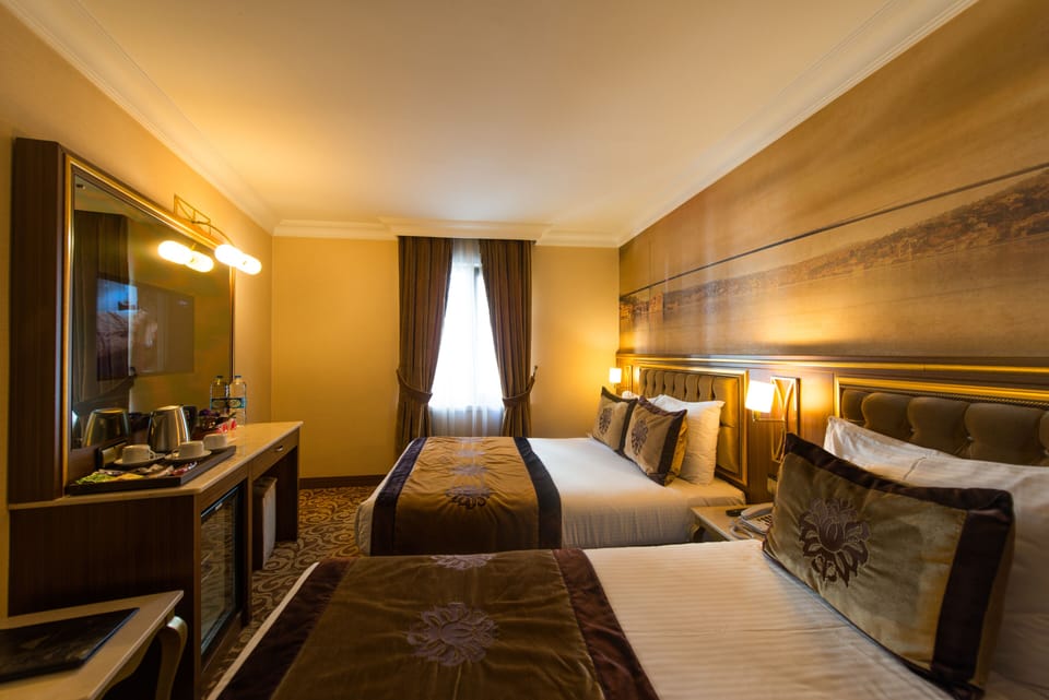 Triple room | Premium bedding, minibar, in-room safe, individually decorated