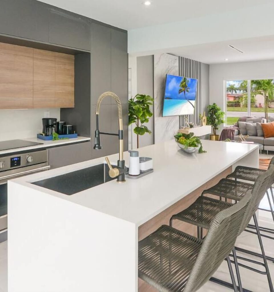 Sit up at the sleek stone breakfast bar for a coffee with seating for four