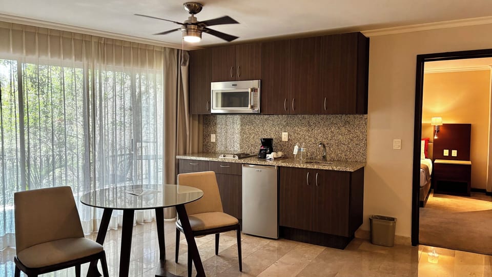 Comfort Studio Suite | Living area | 43-inch flat-screen TV with cable channels, TV, fireplace