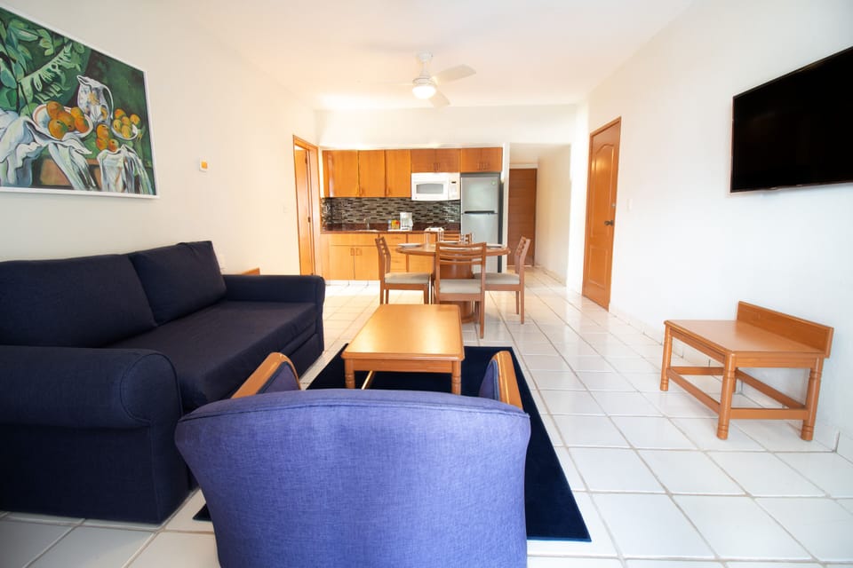 Suite, 1 Bedroom | Living room | 32-inch flat-screen TV with cable channels, TV