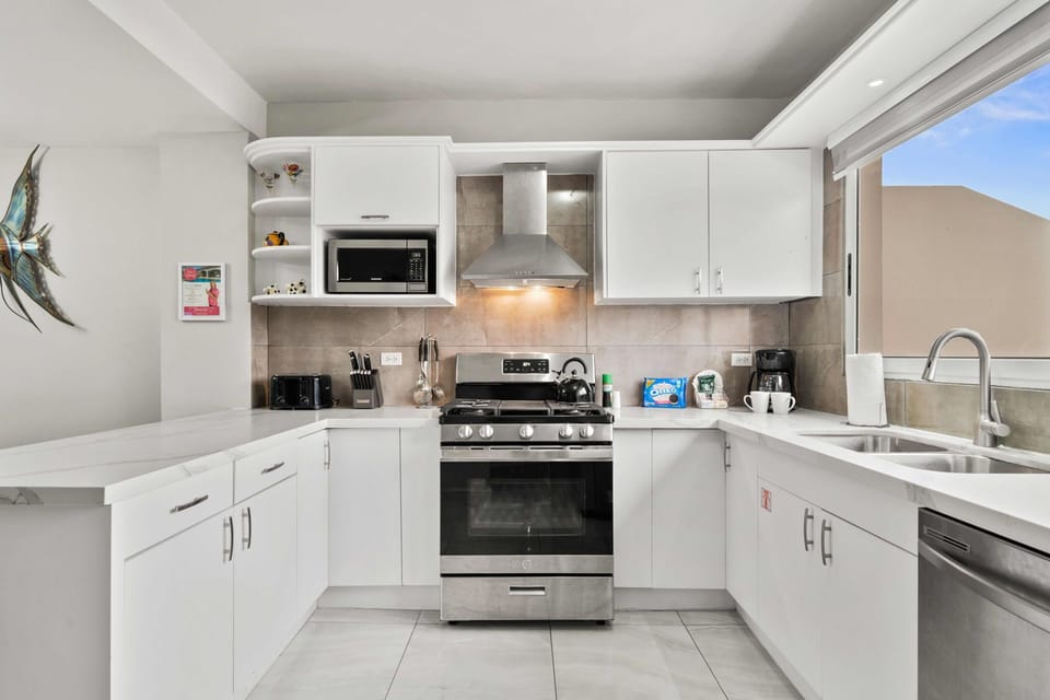 Modern Kitchen Area of the 3BR Condo in Oranjestad Aruba - Fully Equipped - Functional layout designed - Storage space for organized and clutter-free counters - Integrated Appliance