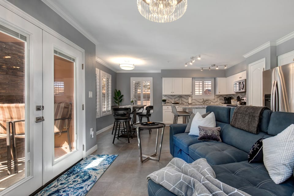Cozy sofa set, outdoor patio view, perfect for dining al fresco.