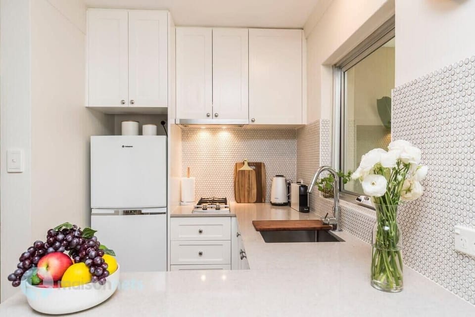 -Stone top kitchen benches throughout
