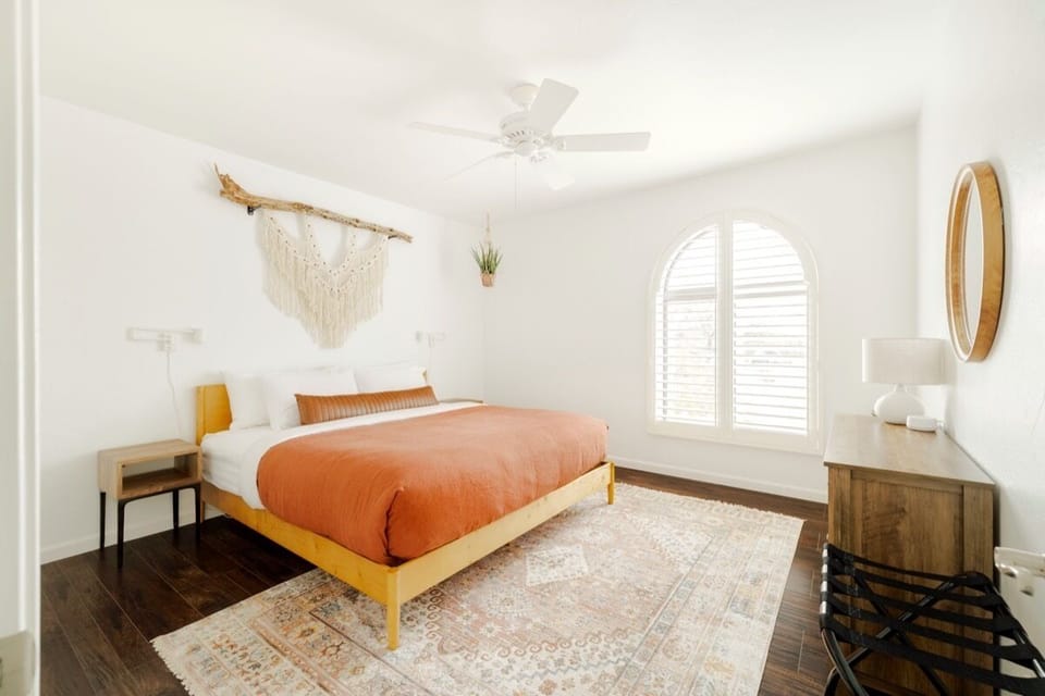 Cholla Room: king bed with a macramé piece made by local Tucson artist.