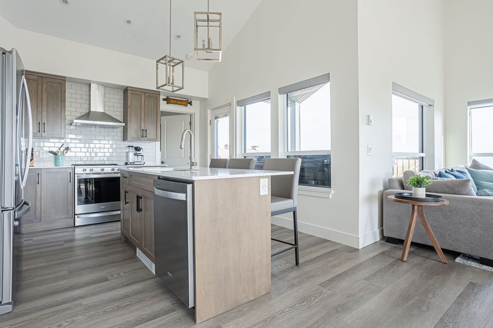 Brand new kitchen with Quartz counters, stainless appliances and lots of light
