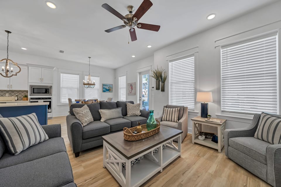 2- 3 seater couches and a 2 swivel chairs with ottomans and 75 in TV!