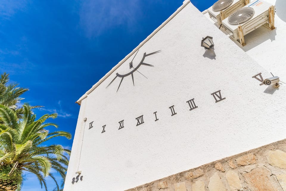 Sundial on side of House