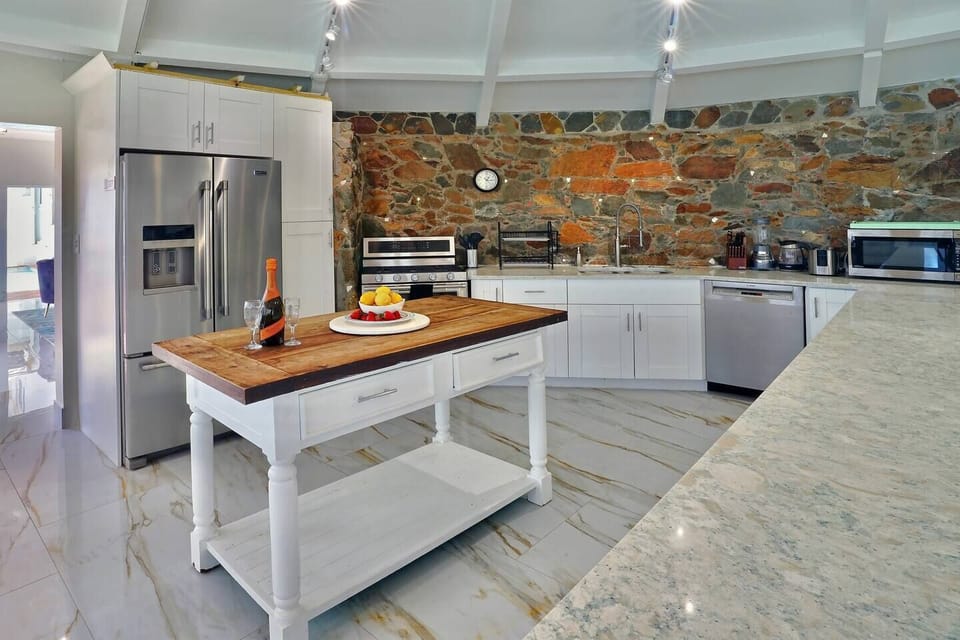 "The large kitchen easily accommodated cooking for nine (and guests) - two full-size refrigerators, two stove tops, and two microwaves."