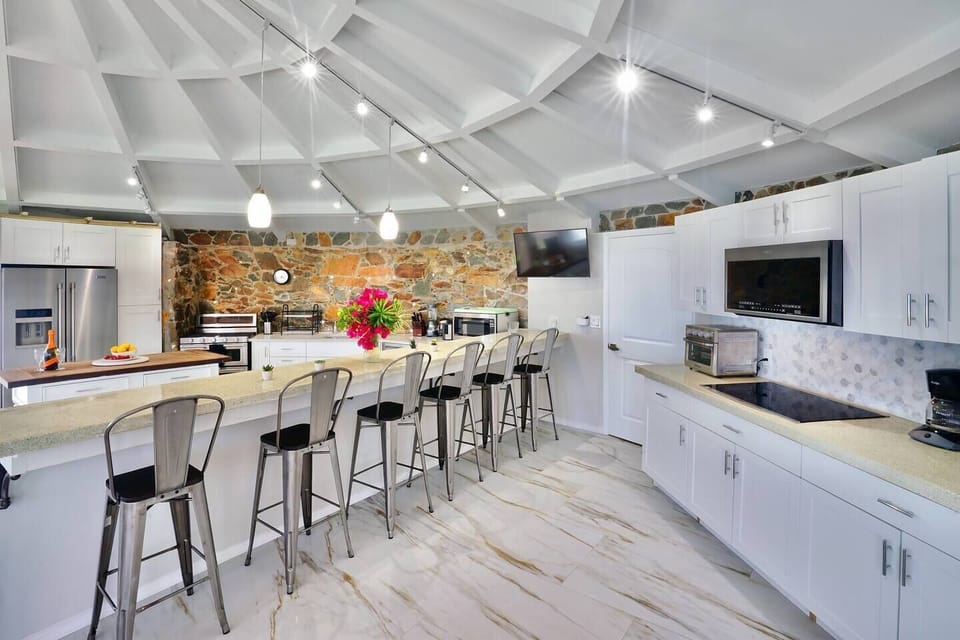 "The villa had plenty of amenities, from the spacious outdoor seating, air conditioning in all rooms, a game room, outdoor pool & jacuzzi, updated kitchen as well as a beautiful sight to see at the center of tutu bay."
