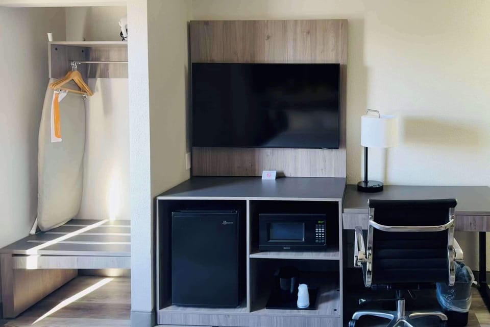 Desk, blackout drapes, iron/ironing board, rollaway beds