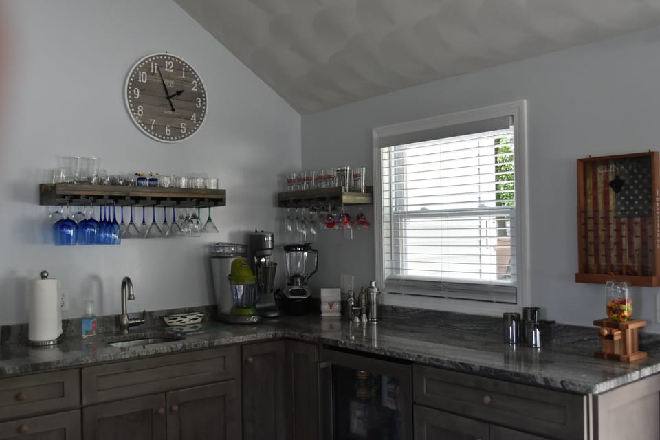Wet bar with margarita machine, blenders, milkshake machine & plenty of barware