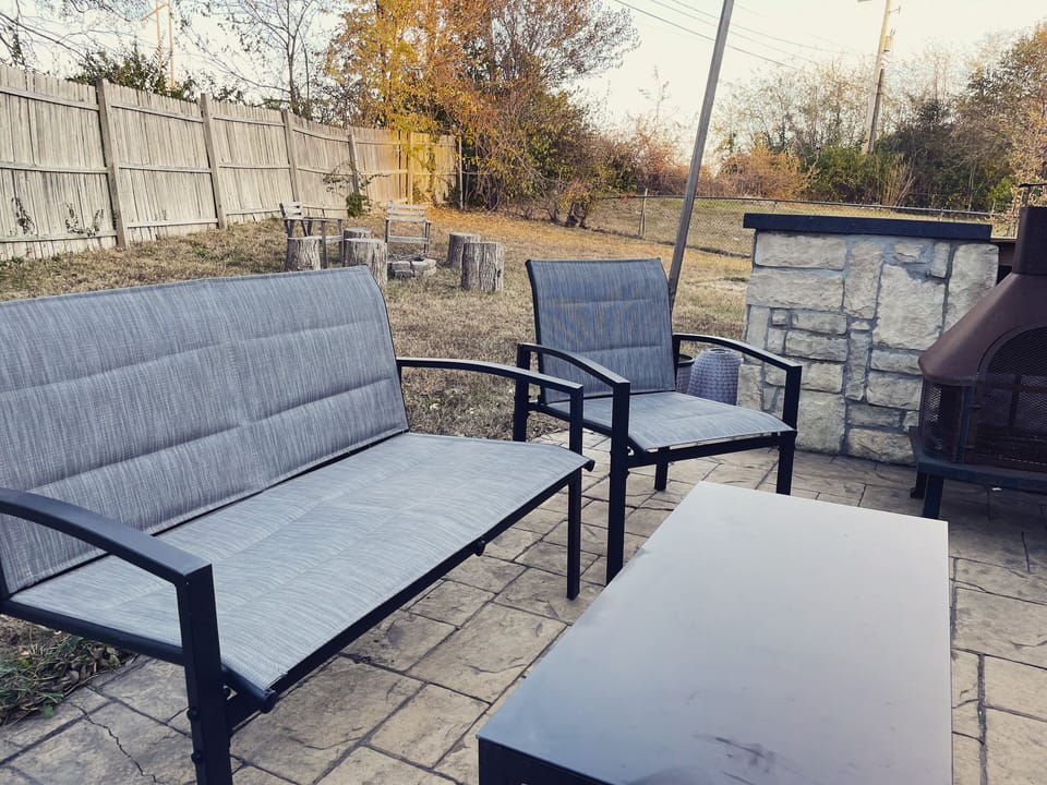 Our patio area has plenty of seating and a gas grill. The yard has a fire pit!