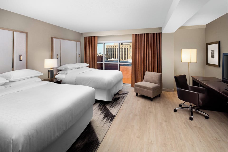 Premium bedding, down comforters, in-room safe, desk