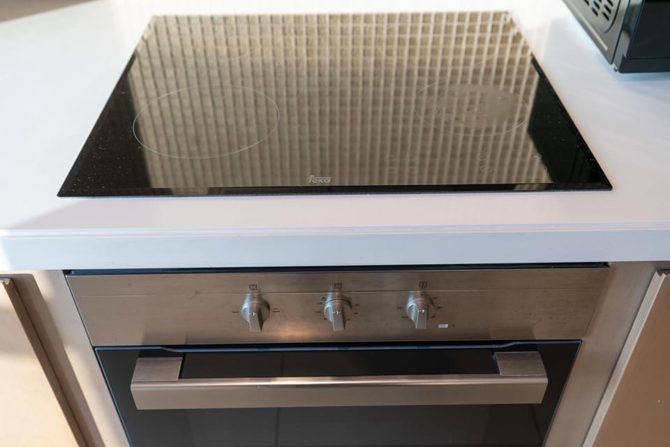 Luxury Apartment | Private kitchen | Full-size fridge, microwave, oven, stovetop