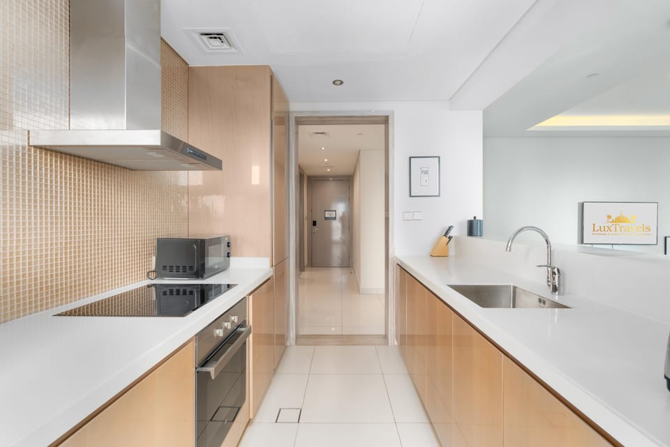 Luxury Apartment | Private kitchen | Full-size fridge, microwave, oven, stovetop