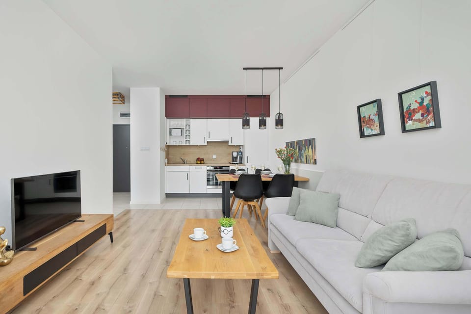 A contemporary living room with neutral tones and warm lighting, perfect for relaxation.