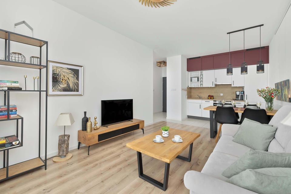 Harmonious combination of living room and kitchenette.