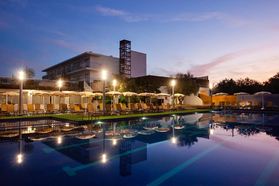 Seasonal outdoor pool, open 11:00 AM to 7:00 PM, pool umbrellas