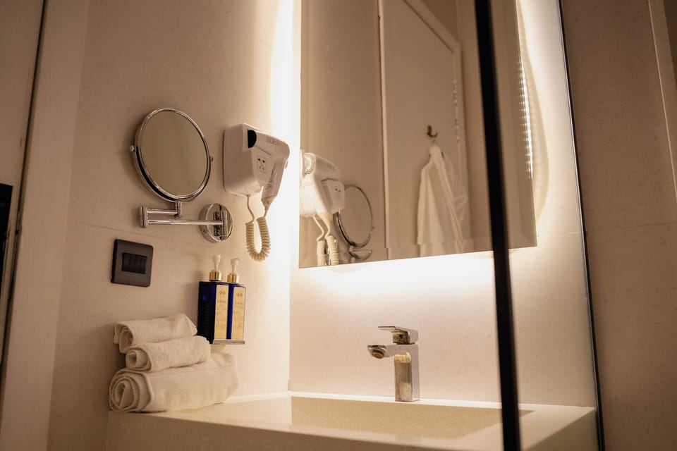 Shower, free toiletries, hair dryer, slippers