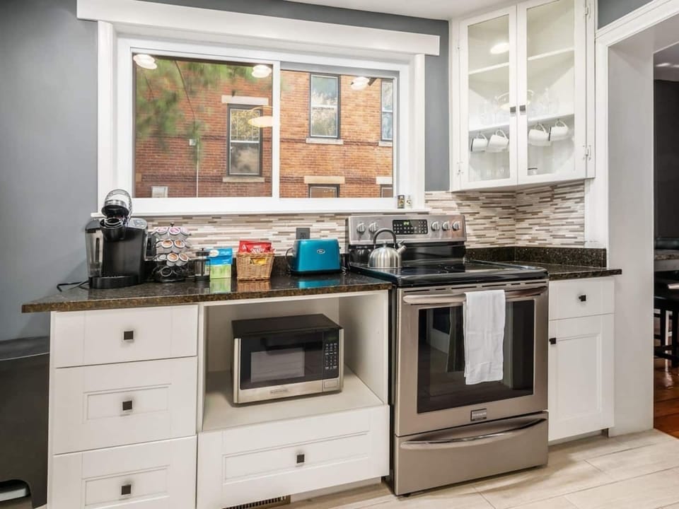 A bright sunny window and all the kitchen needs are met!  Coffee?  yes!  Coffee pods?  yes!  Microwave?  yes!  Toaster?  yes!  Stove?  yes!