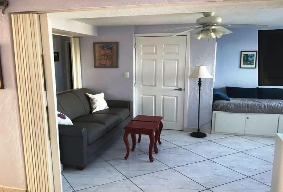 Comfort Condo | Living area | 30-inch TV with cable channels