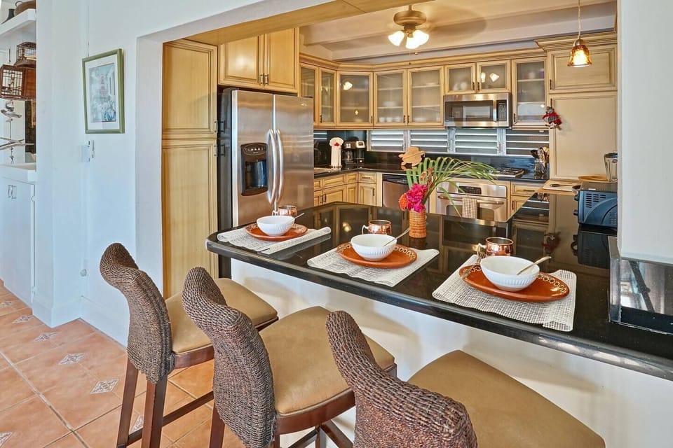 Large kitchen with bar seating for a quick bite.