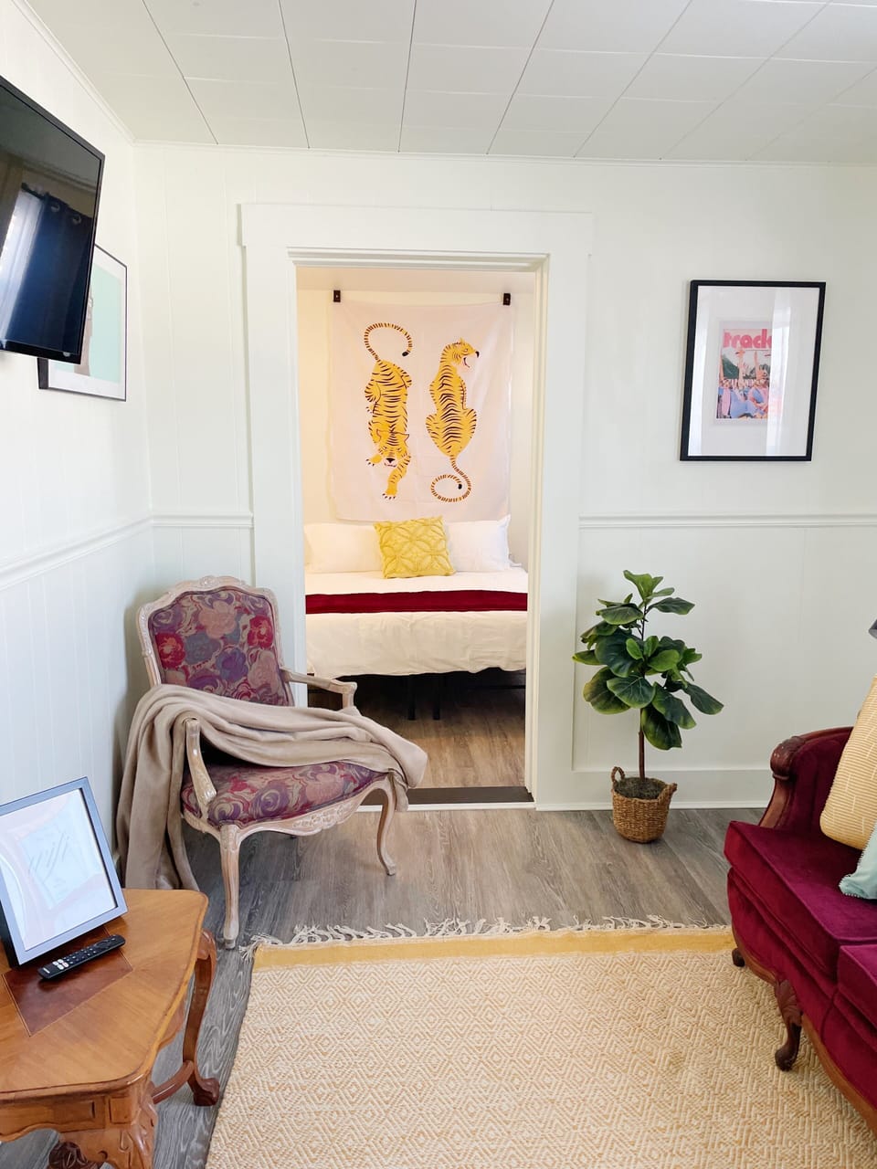 The living room leads into main bedroom and bath!