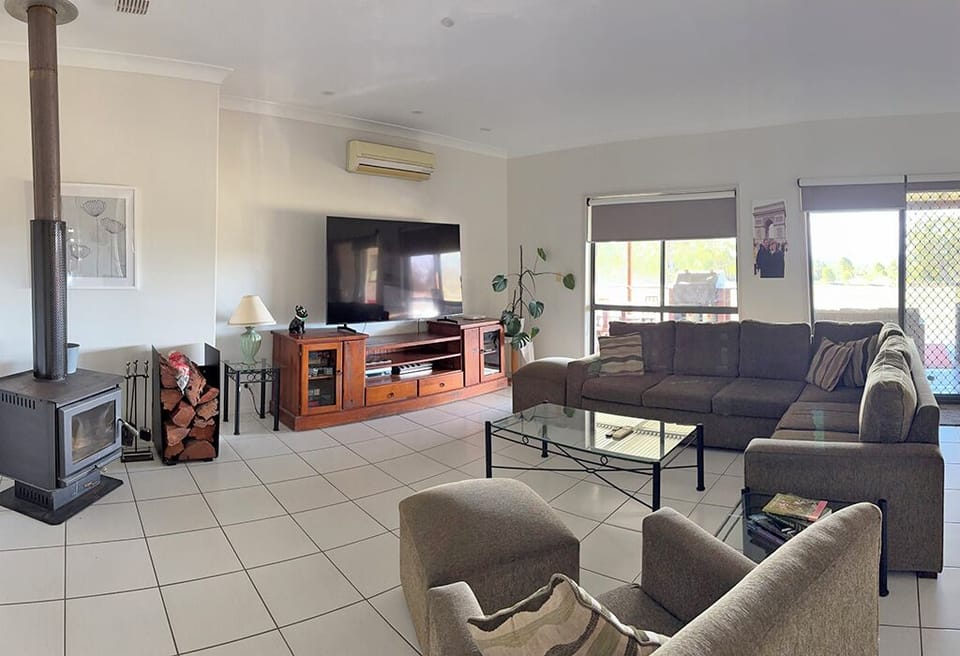 Large lounge area with cosy fire, reverse cycle air con and big comfy couch.