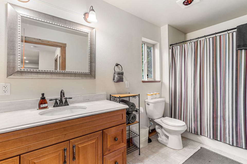 Full bath beside the Queen bedroom with a tub shower