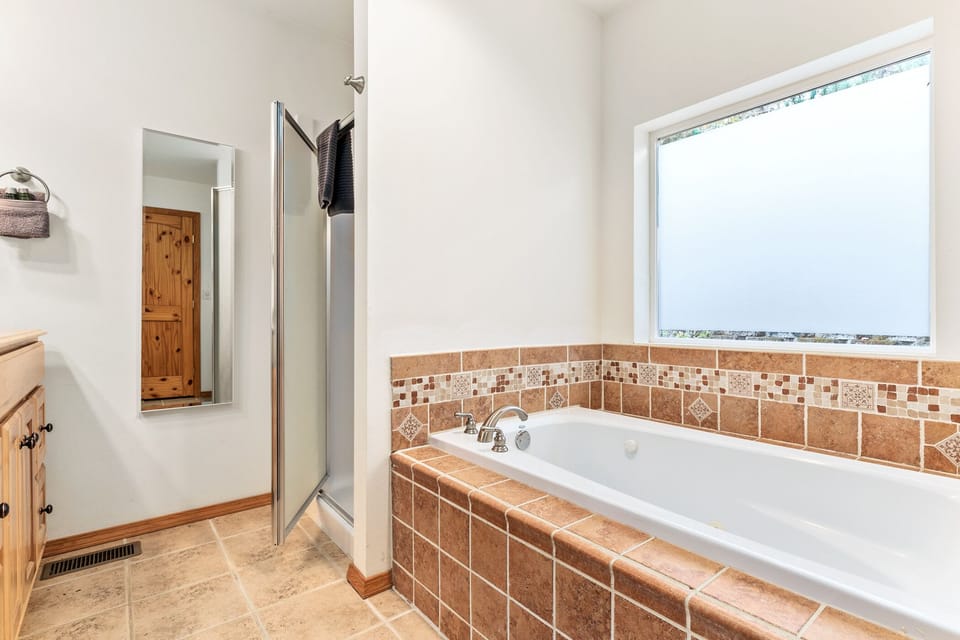 ...Complete with jetted tub and standing shower!