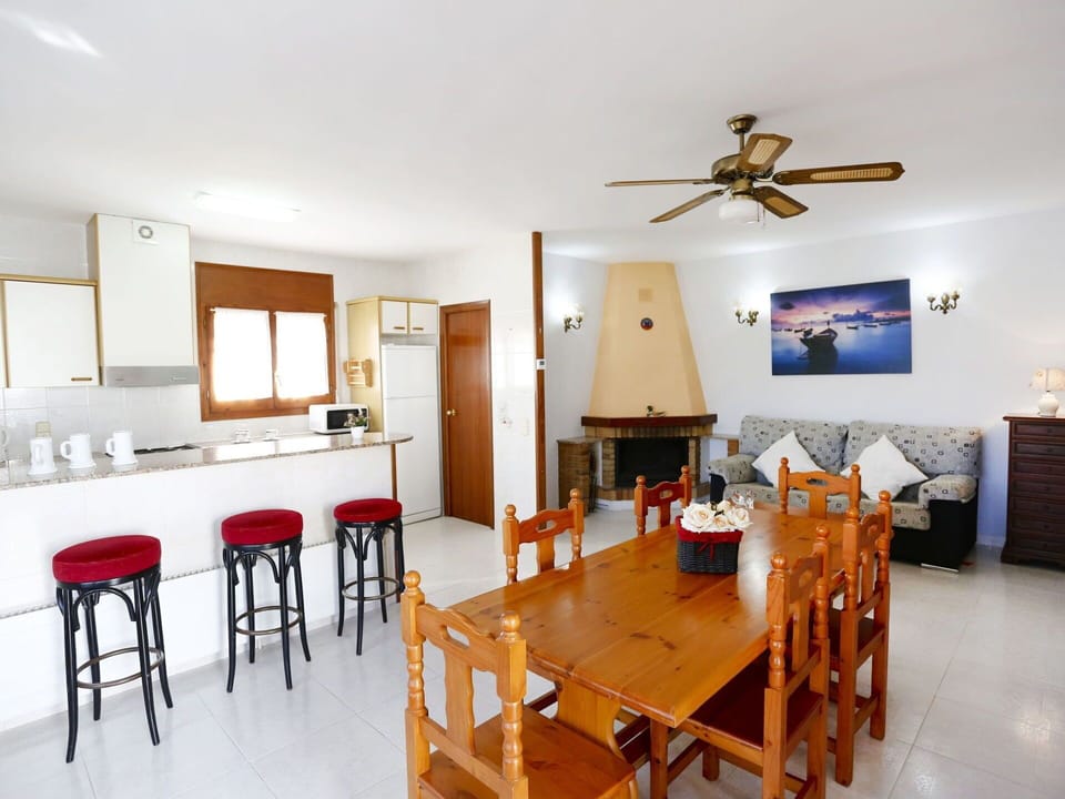 Table, Property, Furniture, Ceiling Fan, Wood, Orange, Chair, Picture Frame, Interior Design, Flooring