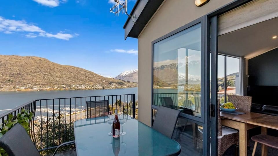 Deck with lake and mountain views