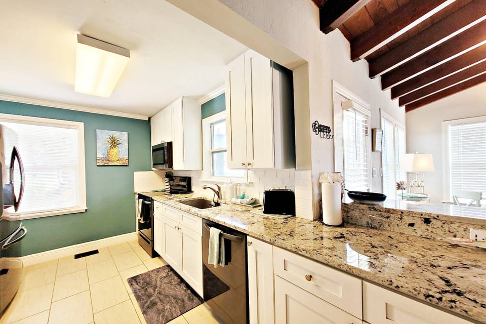 Kitchen with granite countertops, full appliances, frig w/ icemaker, blender, toaster, coffee maker, cookware, utensils, etc.