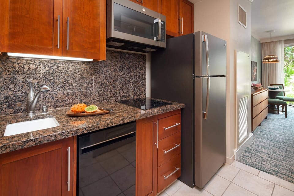 Guest bedroom comes with a well-equipped kitchenette.
