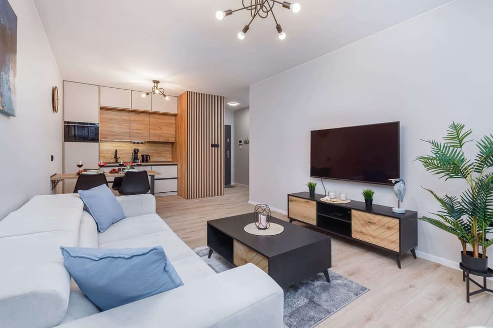 Another angle of a living room with a comfortable seating arrangement.
