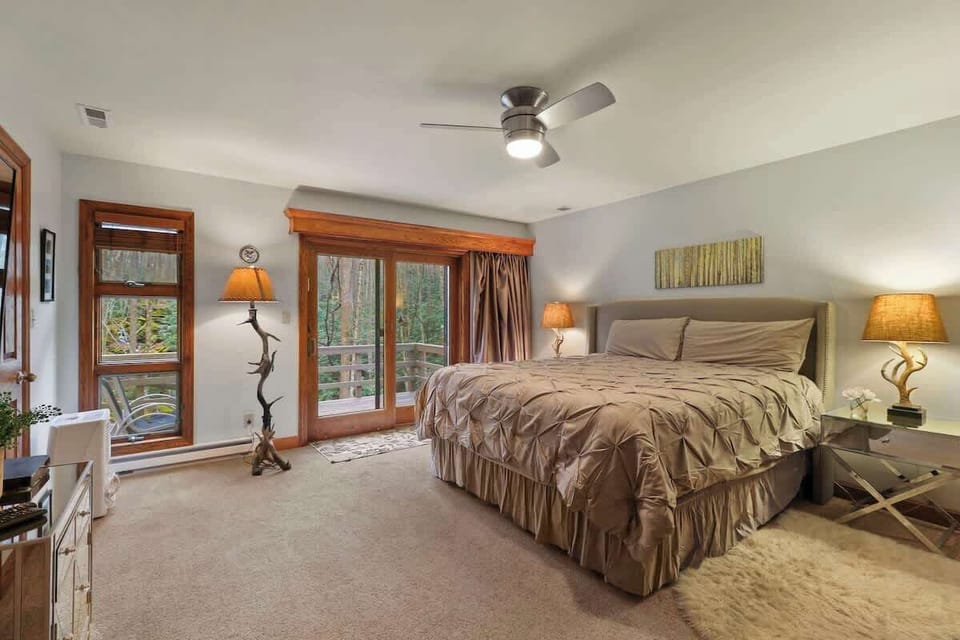 Experience luxury and refinement in our master bedroom, adorned with innovative faux lamp fixtures, and offering balcony access for a refreshing breath of fresh air