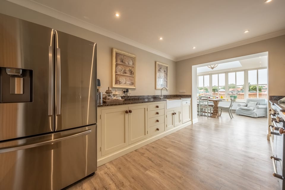 Ground floor: Kitchen featuring large fridge-freezer