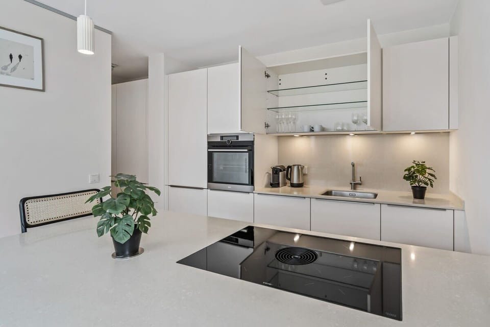 Sleek, fully-equipped kitchen to inspire your culinary creativity.