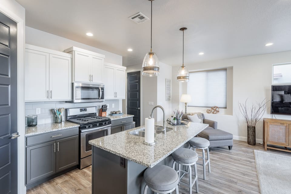 Kitchen Side Angle - This sleek, modern kitchen has all the best upgrades to make cooking a breeze!