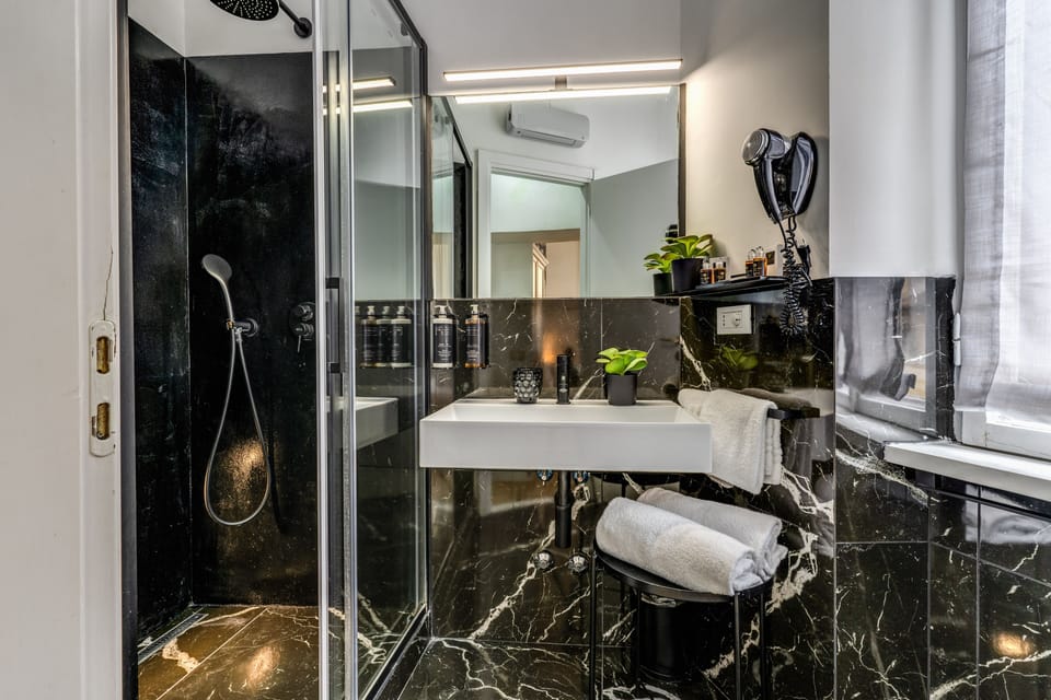 Superior Double Room | Bathroom | Shower, rainfall showerhead, eco-friendly toiletries, slippers