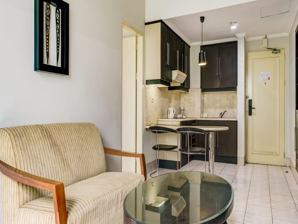 Family Studio | Living area | 32-inch flat-screen TV with cable channels, TV