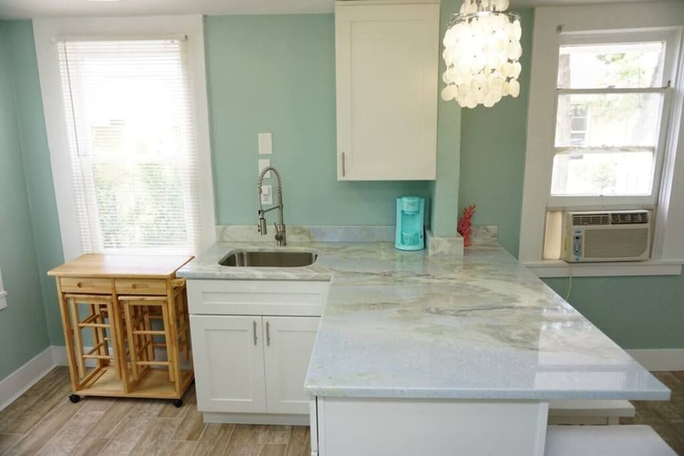 Toaster oven and microwave are provided, but not featured in this picture. The toaster oven is the “oven”.