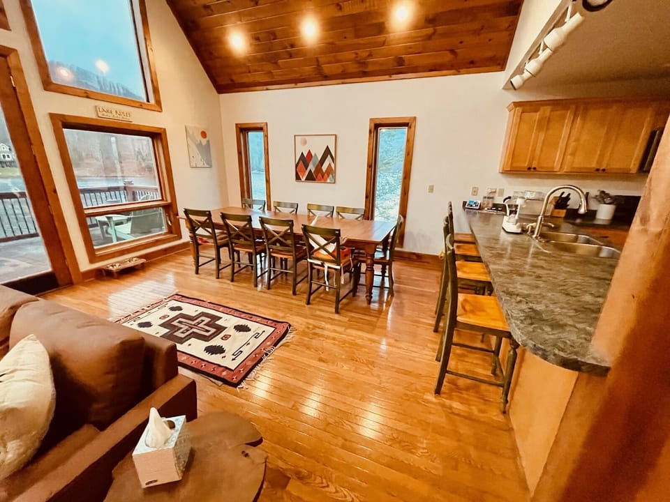 Open living area on the main floor with huge dining table for the whole family.