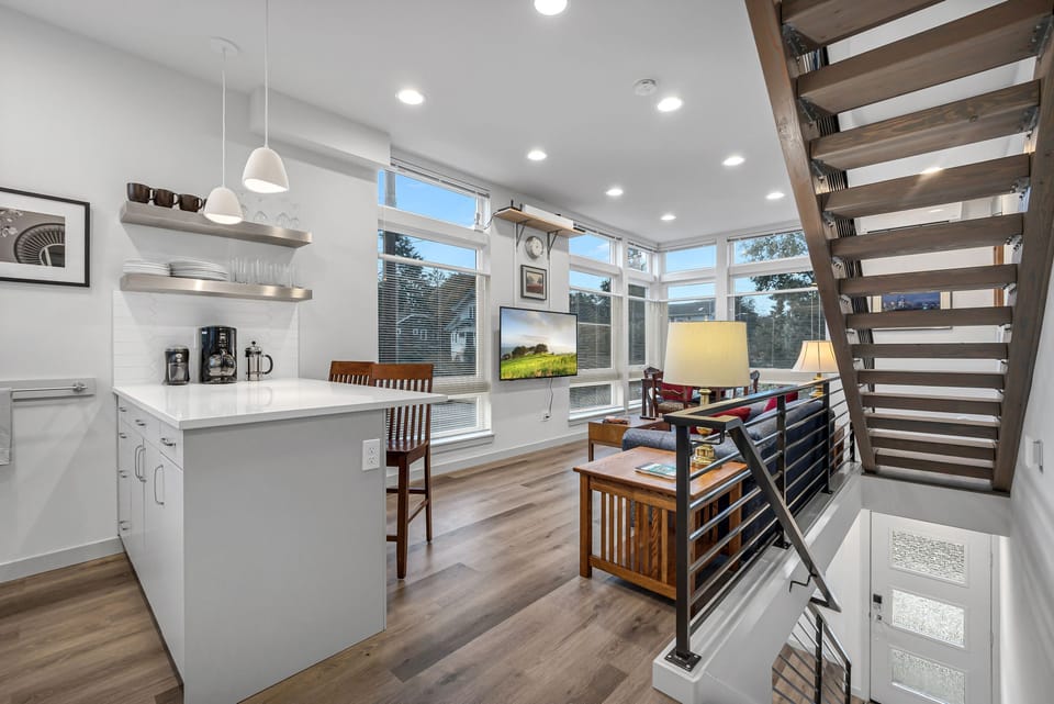 2nd level - kitchen, small dining, and living room with a 55" TV.